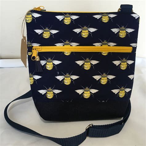 purse with bumble bee logo.